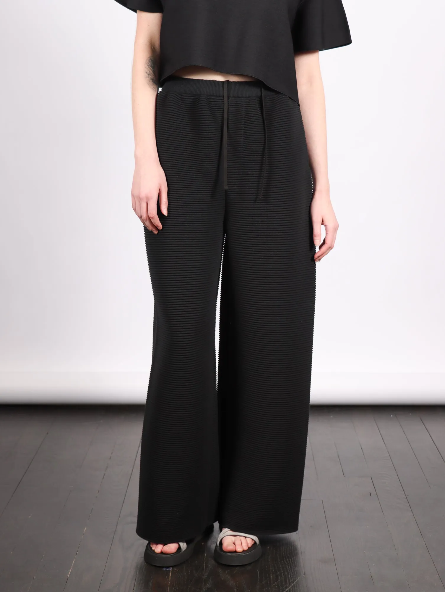 Stratum Wide Straight Pants in Black by CFCL